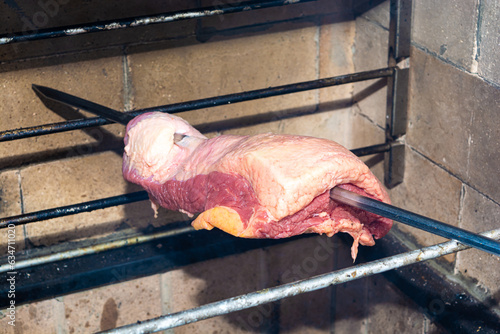 brazilian ponta de peito or brisket, preparing for barbecue with skewer, traditional style cuisine photo