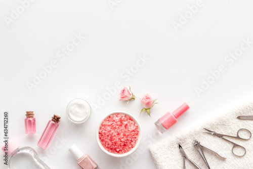 Professional manicure tools with pink roses flowers. Beauty care salon spa.