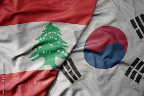 big waving realistic national colorful flag of lebanon and national flag of south korea . photo