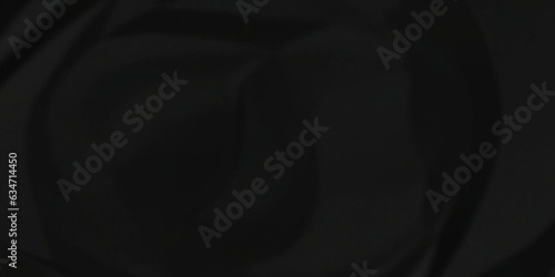 Dark crumple black paper wrinkled poster template ,blank glued creased paper texture background. black paper crumled backdrop background. used for cardboard and clarkboard.
