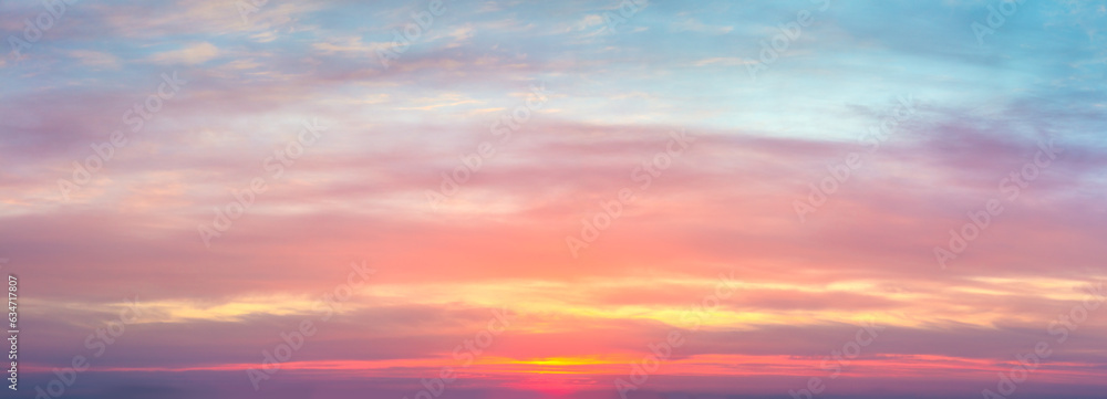 Real amazing panoramic sunrise sundown sunset sky with gentle colorful clouds. real sky and clouds.