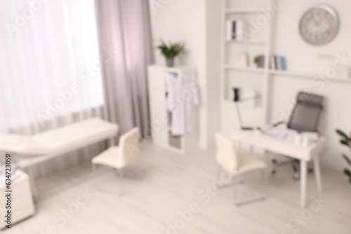 Blurred view of medical office interior with doctor's workplace © New Africa