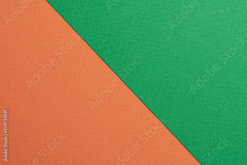 Rough kraft paper background, paper texture orange green colors. Mockup with copy space for text.