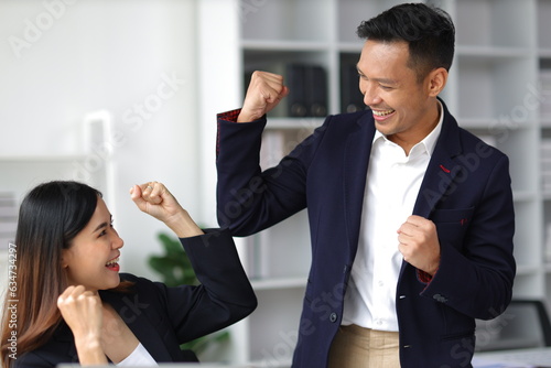 Fotografija Colleagues are thrilled when they see their achievements in their work and are rewarded with bonuses
