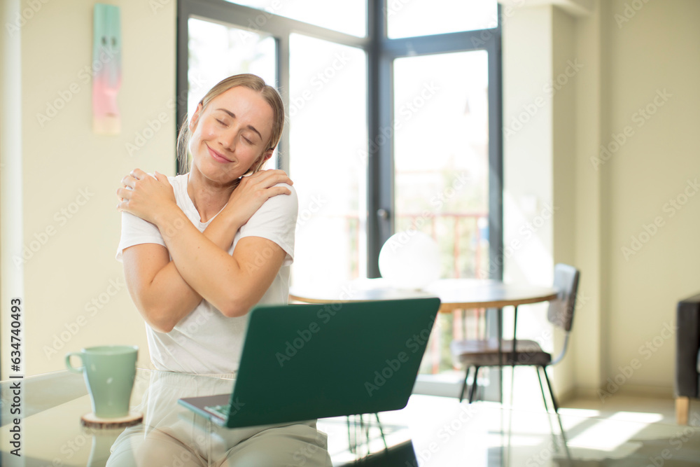 caucasian pretty woman with a laptop feeling in love, smiling, cuddling and hugging self, staying single, being selfish and egocentric caucasian pretty woman with a laptop feeling in love, smiling, cuddling and hugging self, staying single, being selfish and egocentric