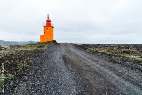 Pretty orange Hopsnes Lighthouse near Grindavik, Iceland on the Reykjanes Peninsula photo