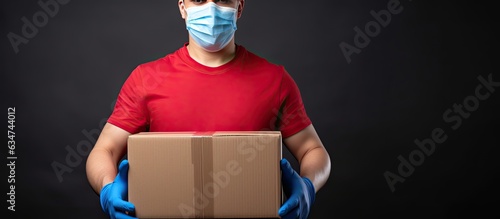 Delivery person with protective gear carrying boxes Fast and free online shopping with express delivery photo