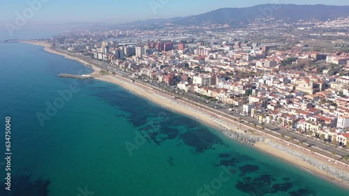 Aerial view of residential areas and the coast of the small Catalan town of Vilasar de Mar, Spain. photo