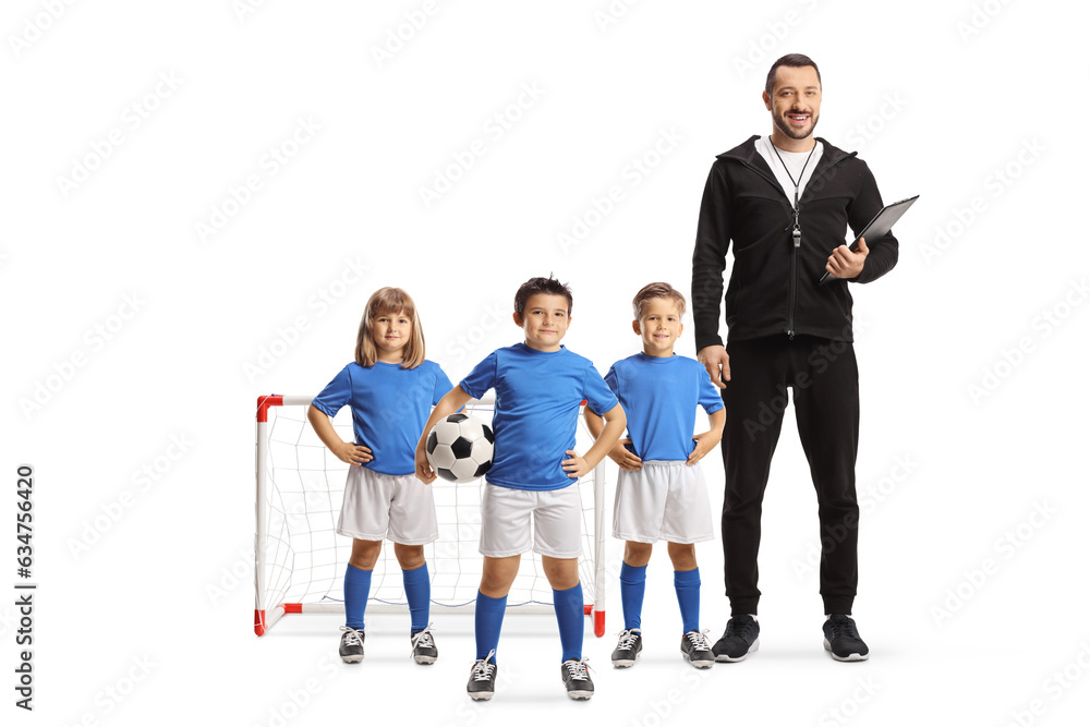 Group of children posing with a football coach