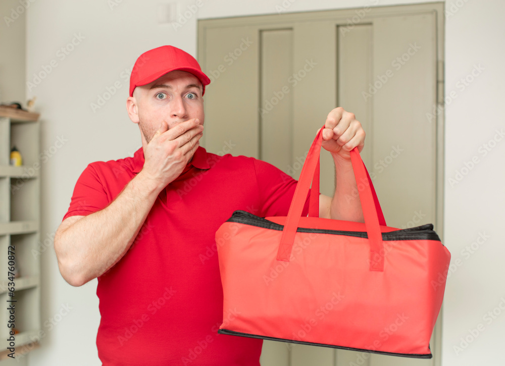 covering mouth with a hand and shocked or surprised expression. pizza delivery concept covering mouth with a hand and shocked or surprised expression. pizza delivery concept