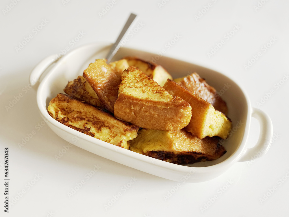 bite-sized pieces french toast on the white table bite-sized pieces french toast on the white table