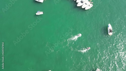 Drone Footage of Chicago skyline and lakefront with busy traffic and boats on a warm summer day