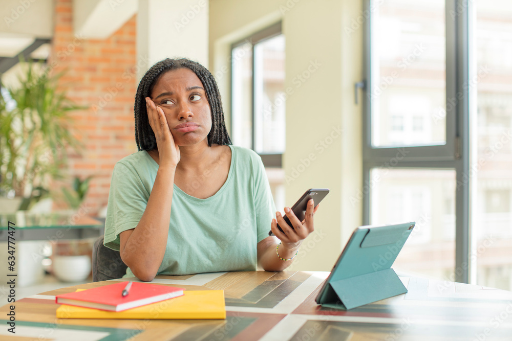 black afro woman feeling bored, frustrated and sleepy after a tiresome. studying concept black afro woman feeling bored, frustrated and sleepy after a tiresome. studying concept