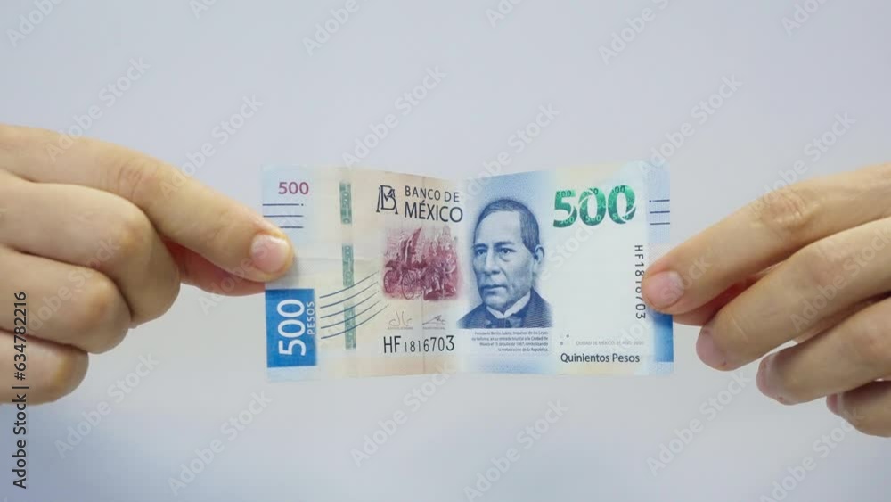 Male Hands Showing 500 Mexican Pesos Bill Male Hands Showing 500 Mexican Pesos Bill