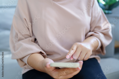 Woman hand using smartphone  for checking social media  or   woman reading ebook on screen