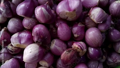 Red onion close up. Horizontal footage, Heap of raw peeled red onion and fresh
