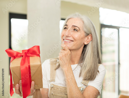 senior woman holding a gift box