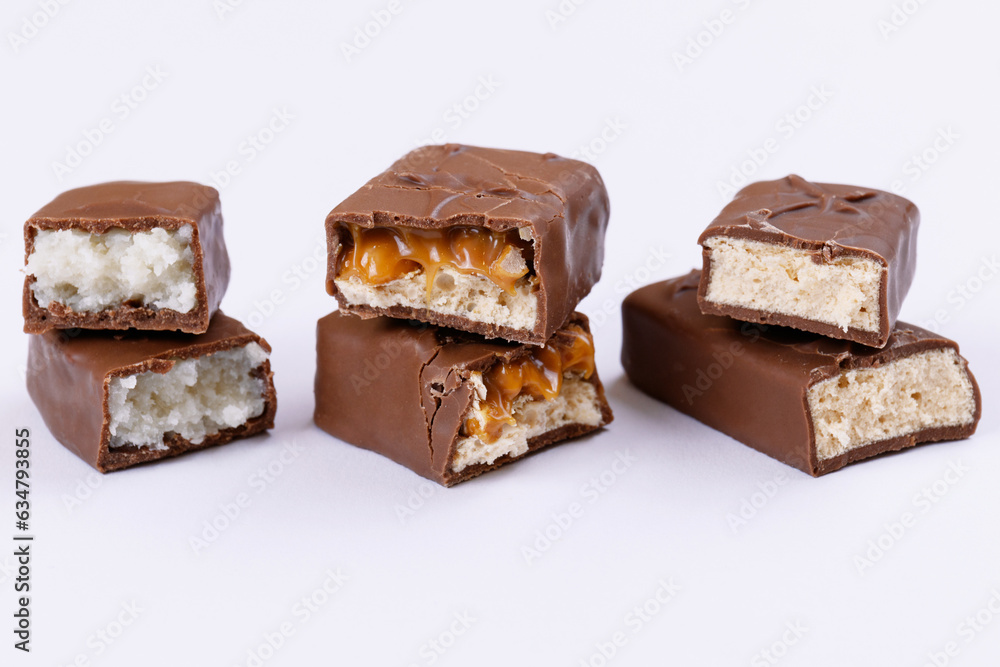 Set of chocolate bars broken into two pieces. Close-up. Set of chocolate bars broken into two pieces. Close-up.