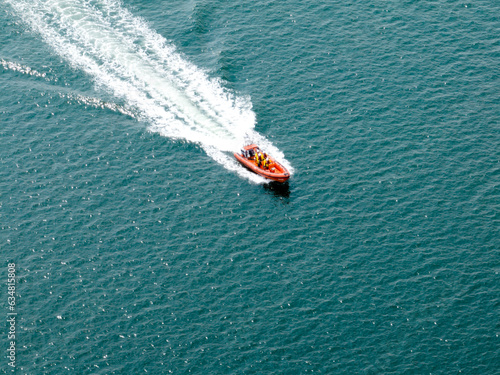 Aerial photograph of a inflatable lifeboat speeding at sea