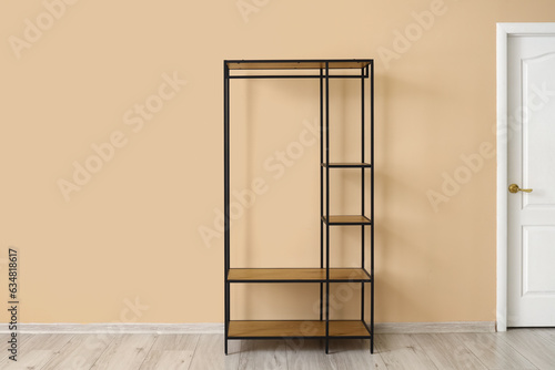 Empty shelving unit near be...