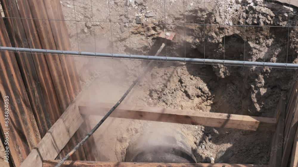 Hot steam comes out of the Underground pipe. Buried for fixing