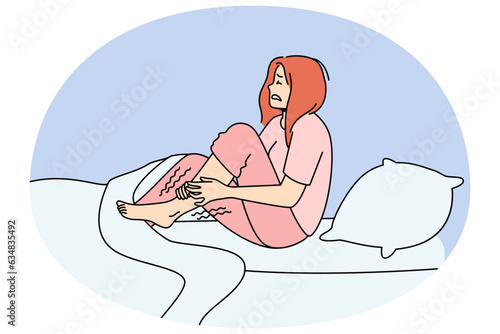 Unhappy woman in bed at night suffer from restless leg syndrome. Unhealthy female struggle with cramp. Healthcare concept. Vector illustration.
