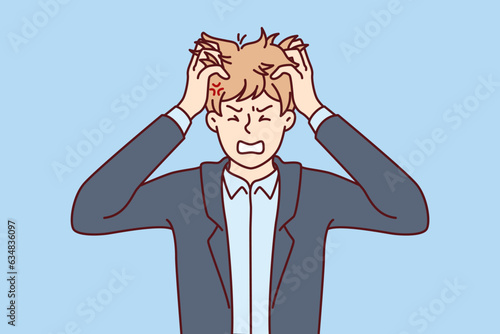 Nervous man tears hair out because of problems in personal life or trouble with work. Nervous guy in business suit bares teeth, feeling annoyed due to professional burnout and overtime