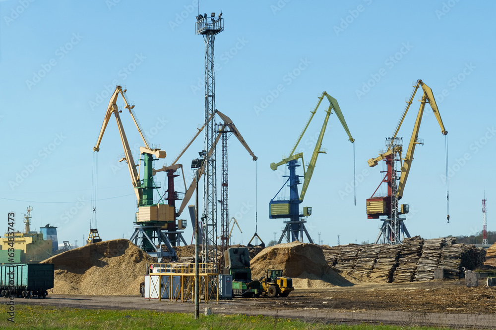Logs are stacked in the port for loading onto ships. Logs are stacked in the port for loading onto ships.