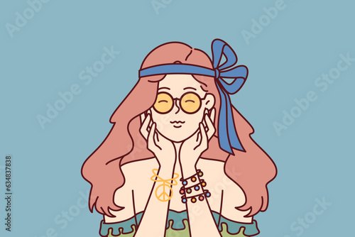 Hippie woman with pacifist bracelet closes eyes and touches chin remembering woodstock music festival. Girl is fan of hippie subculture, personifying ideas of peace and fight against war