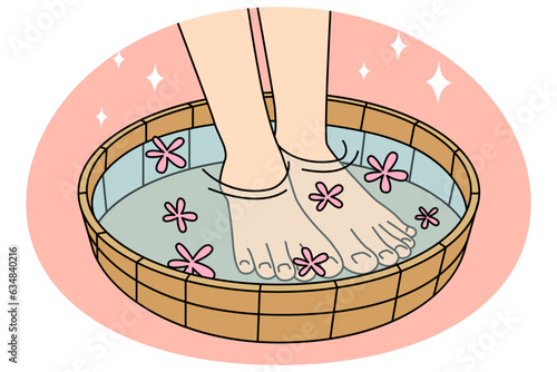 Close-up of legs in bowl with water and flowers. Person enjoy procedures in spa or saloon. Aromatherapy and relaxation. Vector illustration.
