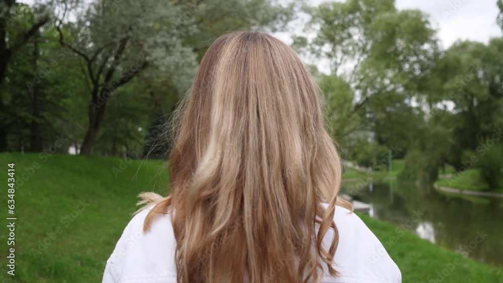 blond woman head walking back view slow motion blond woman head walking back view slow motion