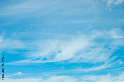 blue background on the photo white clouds and blue sky