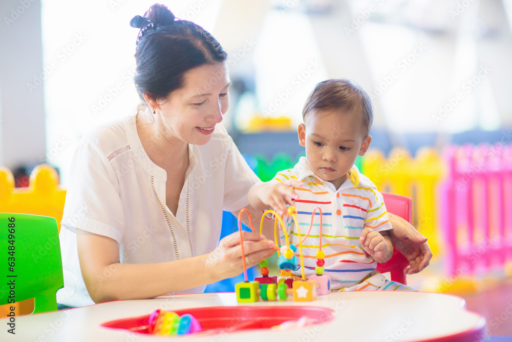 Cute baby boy in kindergarten or daycare. Cute baby boy in kindergarten or daycare.