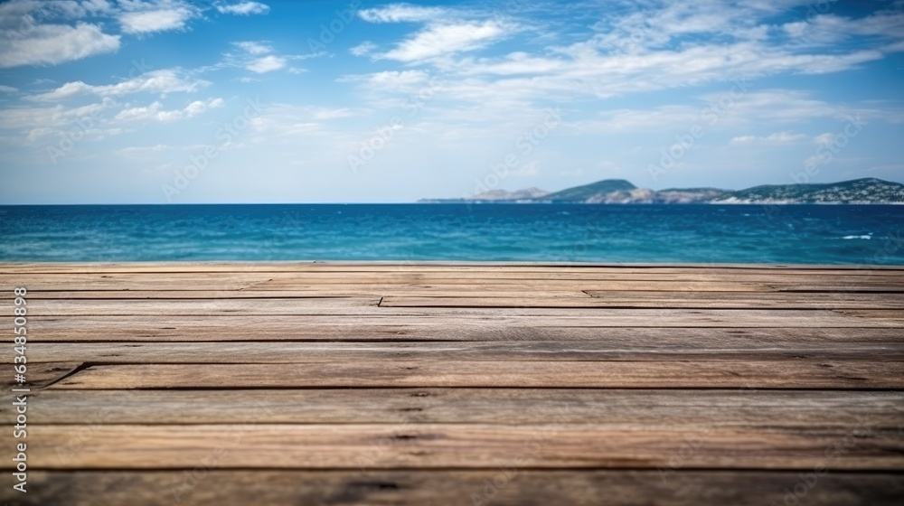 Fototapeta premium In the summer, a wooden tabletop overlooks a misty sea. A wooden table along the sea, with an empty blue sky in the background. idea for a summer vacation on the ocean