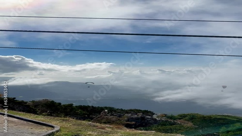 Paragliders fly in the sky photo