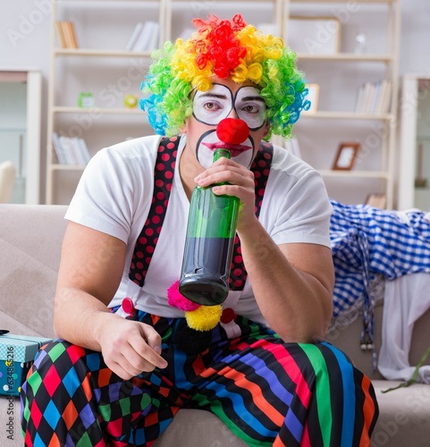 Wall Mural Drunk clown celebrating having a party at home