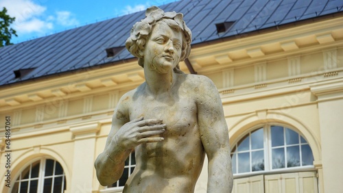 Warsaw, Masovian Voivodeship, Poland - July 20, 2023 Statue in antique style near the museum. Statue in the "Łazienki Królewskie" park.