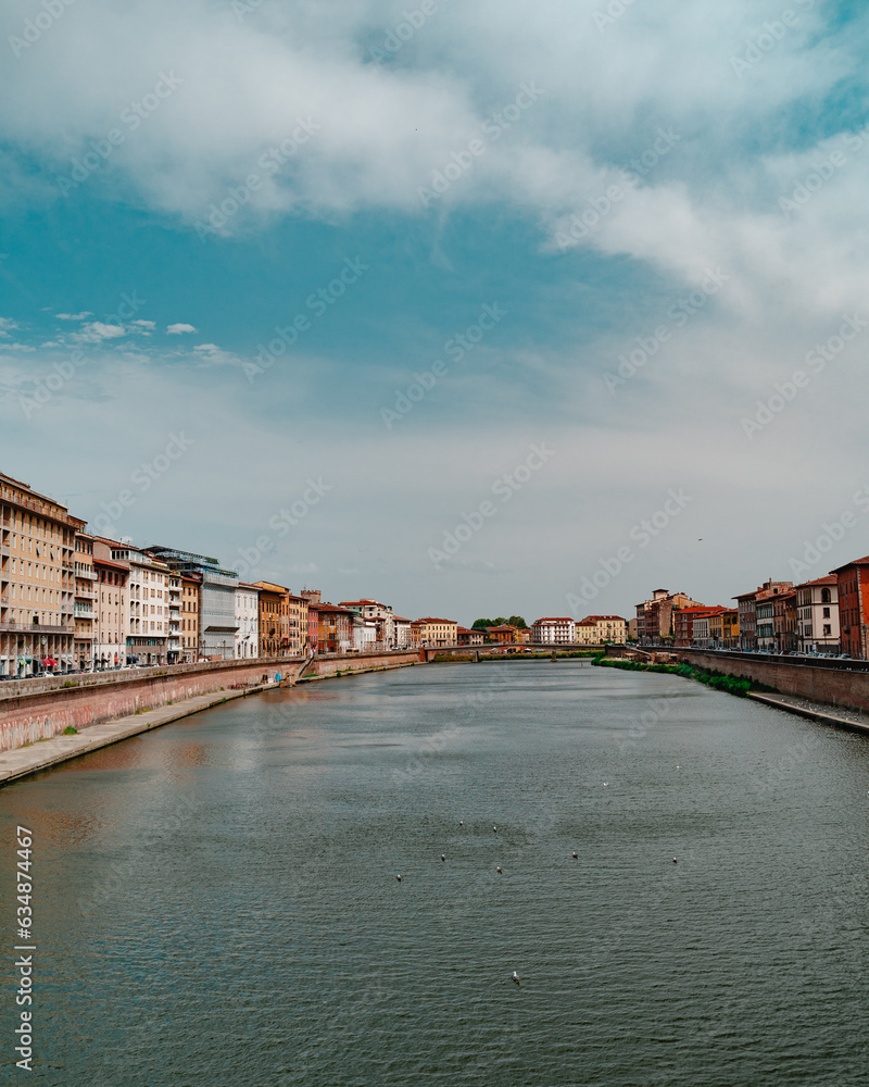 Arno river passing through residential buildings in old town