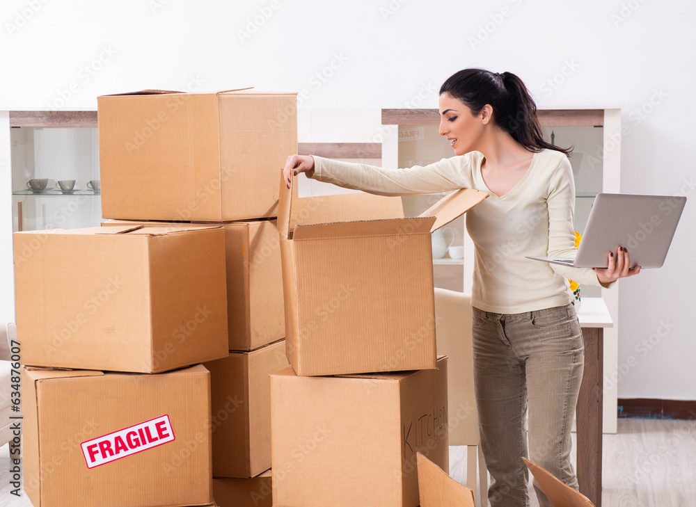 Young woman moving to new flat Young woman moving to new flat