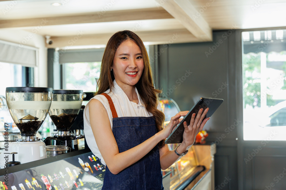 coffee shop owners standing smiling with arms crossed look at camera coffee shop owners standing smiling with arms crossed look at camera