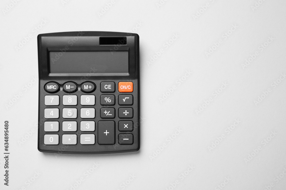 Calculator on light gray background, top view. Space for text Calculator on light gray background, top view. Space for text