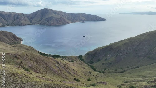 Wallpaper Mural A scenic bay on the island of Komodo is fringed by healthy coral reef. This is a popular island to visit as it is home to Komodo dragons as  well as extraordinary marine biodiversity. Torontodigital.ca