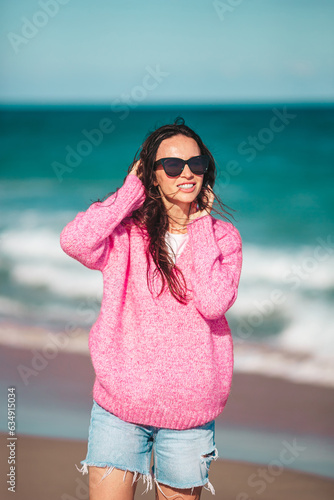 Young beautiful woman on the beach vacation