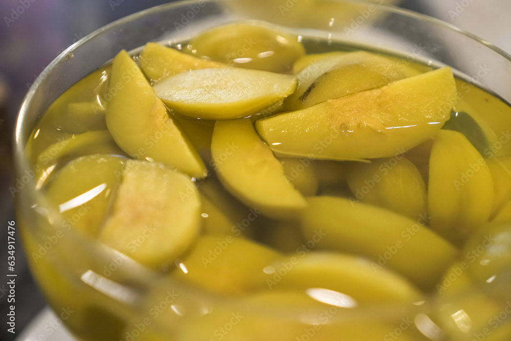 Manisan Buah Kedondong or Candied Ambarella Fruit in sweet sugar soup for dessert. Concept for Hotel Restaurant Wedding Buffet. Manisan Buah Kedondong or Candied Ambarella Fruit in sweet sugar soup for dessert. Concept for Hotel Restaurant Wedding Buffet.