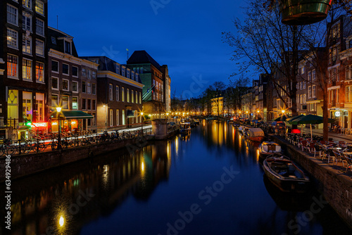 View of the Amsterdam canals and embankments along them at night. © Andrey