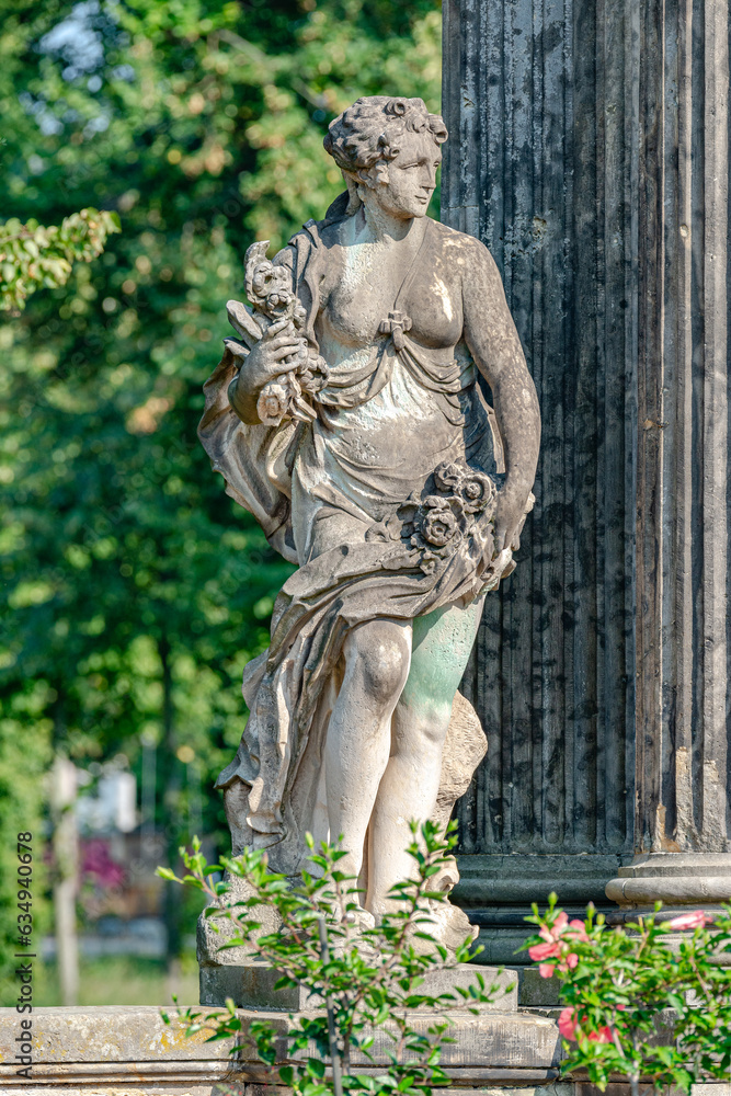 Fototapeta premium Potsdam, Germany - Old statue of a sensual Renaissance era woman after bathing in the city park and gardens of Potsdam, details, closeup.