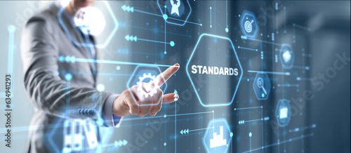 Businessman clicks Standards Quality assurance and control concept