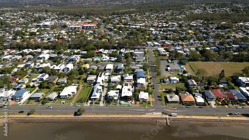 Aerial view moving left to right of Sandgate and Brighton waterfront on a sunny day, Brisbane, Queensland, Australia photo