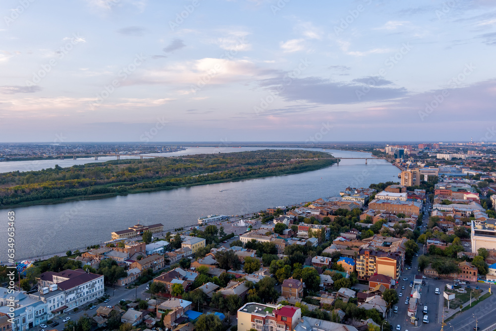 Astrakhan, Russia. Volga river. City Island. Panorama of the city from the air in summer. Sunset time. Aerial view