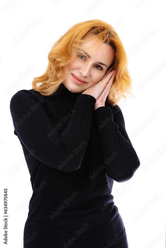 Portrait of woman keeps hands pressed together under chin, looks with happy expression, isolated on white background. Beautiful caucasian woman smiling on camera amd posing in studio. Portrait of woman keeps hands pressed together under chin, looks with happy expression, isolated on white background. Beautiful caucasian woman smiling on camera amd posing in studio.